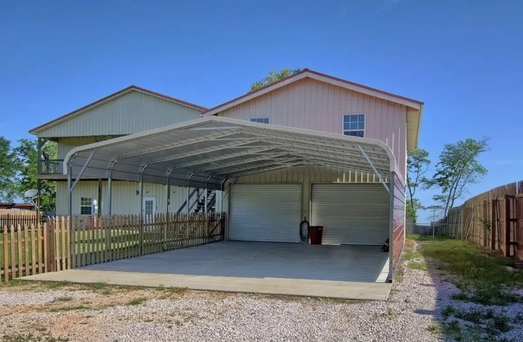 Double wide, deep car port with electricity for charging batteries.