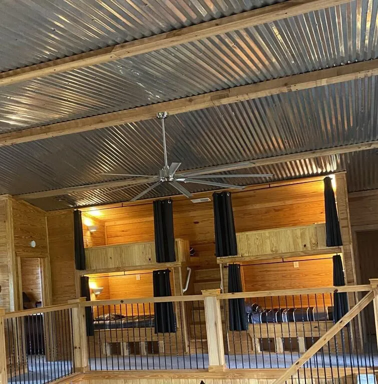 Custom built-in bunk beds have twin XL mattresses and privacy curtains