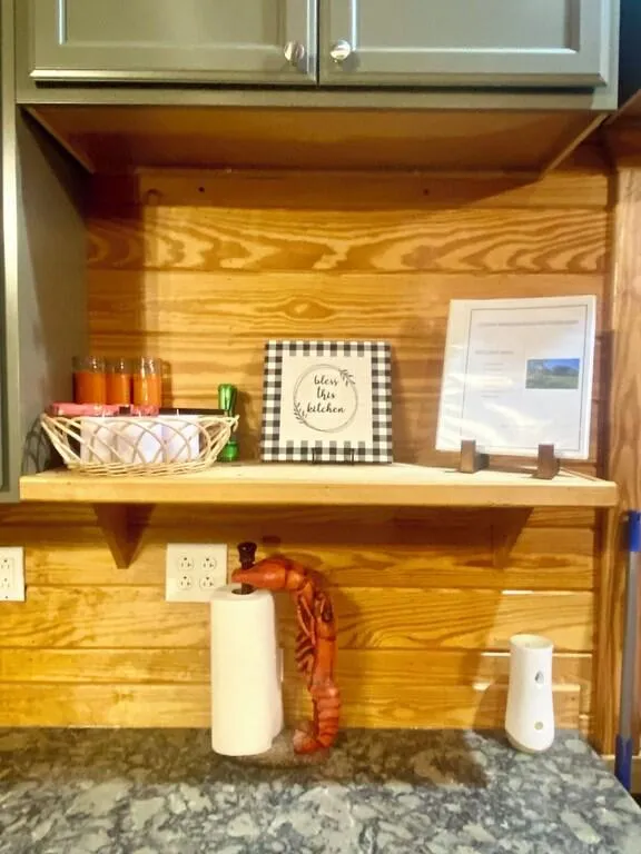 Welcome book is located on the kitchen shelf.