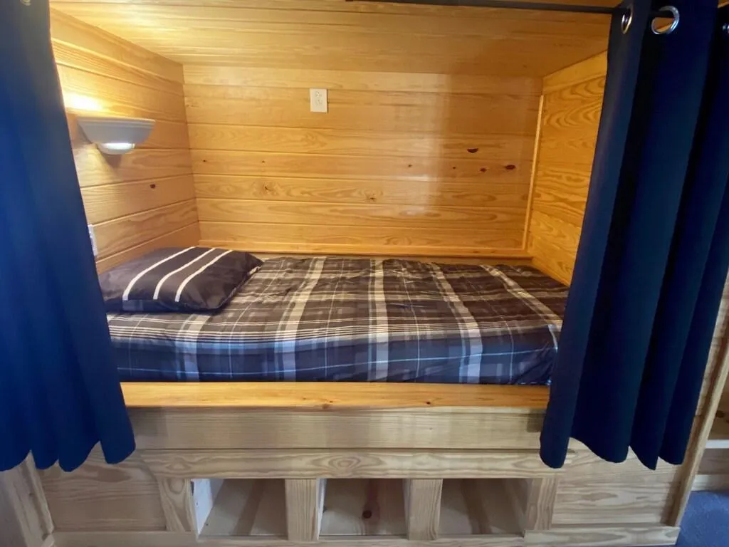 Each bed has dimmable sconce lights and outlets for phones/laptops.